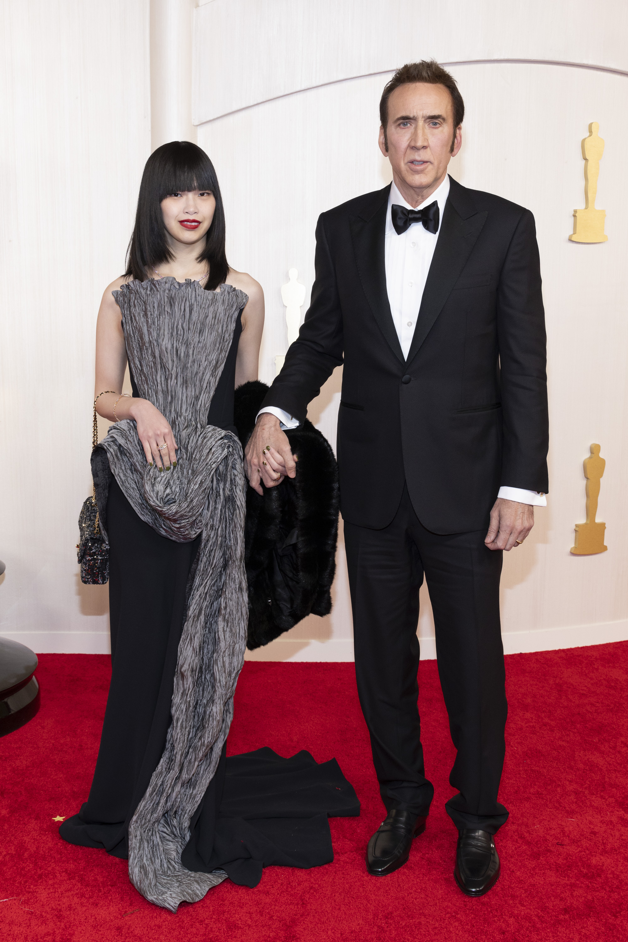 Riko Shibata and Nicolas Cage at the 96th Oscars on March 10, 2024. | Source: Getty Images